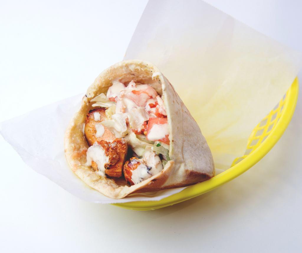 Chicken Kebob Sandwich · Chicken kebob 	marinated cubes of chicken breast, skewered and grilled; served in a pita pocket with lettuce, tomatoes, onions and tahineh sauce.