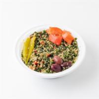 Tabbouleh · Bulgur wheat salad mixed with finely chopped mint, parsley, garlic, onions and peppers. Garn...