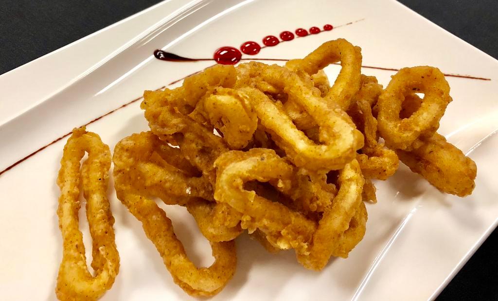 13. Calamari Puffs · Breaded calamari fried to golden crispy. Served with Thai garlic sauce.