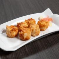 18. Shumai · Shrimp filled dumpling, pan fried and served with garlic sauce.