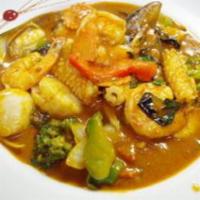 7. Thai Chili Tamarind Seafood · Fresh Thai basil, stir fried with scallop, shrimp, squid, musscle, chili, pepper, onion, car...