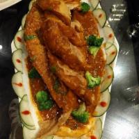 Red snapper ( whole fish) · Deep fried whole red snapper cooked with diced pepper , onion , broccoli and fresh basil wit...