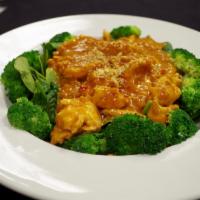 5. Amazing Curry · Our famous peanut curry sauce cook with coconut milk, over a bed of steam broccoli and spina...