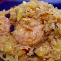 3. Pineapple Fried Rice · Thai jasmine rice stir fired with chicken, shrimp, egg, peas, carrot, sweet pineapple, raisi...