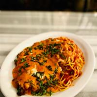 Chicken Parmesan · Sauced with vodka sauce, served with spaghetti marinara.