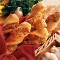 Garlic Parmesan Twists™ · Rolled fresh daily and baked to perfection with fresh garlic, three-cheese blend and Parmesa...