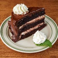 Chocolate Delight · layers of dark chocolate, creamy cheesecake brownie and chocolate mousse filling, dark choco...