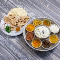 Thali - Available only from 11:30AM onwards · Served with white, seasoned rice, curd rice, all curries of the day, dal, sambar, rasam, des...