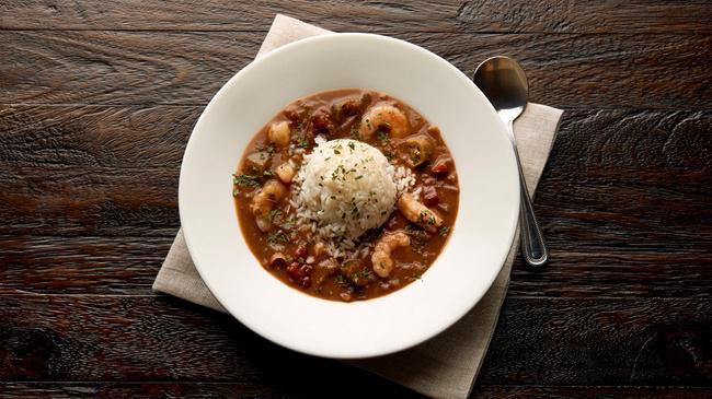 Spicy Seafood Gumbo · Spice up your meal! Starting with a traditional roux, fresh fish, wild Gulf shrimp, real okra, onions and bell peppers throughout, our gumbo is sure to remind you of The Big Easy. It’s topped with fluffy white rice and parsley.