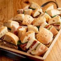 Mini Tuscan Focaccia Tray (2910 cal) · Roasted turkey breast, roasted tomatoes, pesto aioli and Asiago mini sandwiches are paired w...