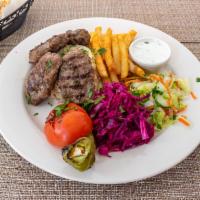 Turkish Meatballs · Turkish beef meatballs with seasoning served with rice, fries and salad