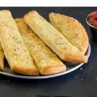 Garlic Butter Stix · Our classic pan pizza dough baked to perfection and topped with savory garlic butter & our s...