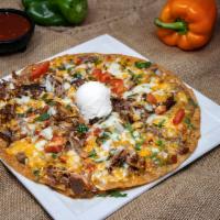 Mexican Pizza · Choice of Shredded or Ground Beef, Shredded Chicken, Asada or Carnitas • Crisp Flour Tortill...