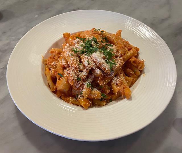 Spicy Mostaccioli with Dungeness Crab · Spicy tomato cream sauce, onion, garlic, Dungeness crab, shrimp, Romano.