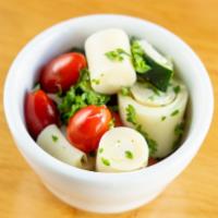 Heart of Palm Salad (8 oz.) · Hearts of palm, grape tomatoes and sliced cucumber drizzled with olive oil and topped with f...