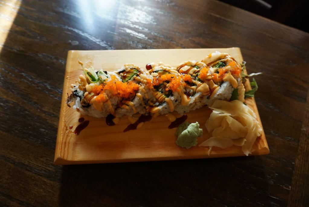 Spider Roll · Softshell crab, mixed salad, avocado, cucumber, masago, with spicy mayo and eel sauce over. 