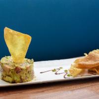 Spicy Tuna Tartare · Micro greens, cucumber, avocado and cilantro mixed with spicy aioli.
