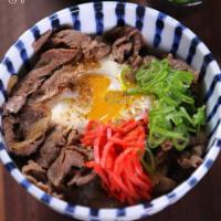 Beef Gyu Don · steamed rice topped with thinly sliced beef and tender onion, simmered in a sweet and savory...