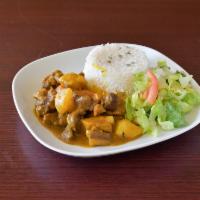 Curry Goat · Served with Rice and Peas or White Rice and Choice of Cabbage or Plantains.