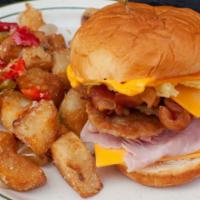 Mama's Breakfast Bomb · Served on a Hawaiian roll with 2 eggs, smoked ham, bacon, sausage and American cheese. Mama'...