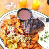Prime New York Steak & Eggs · Prime New York Steak cooked to order, 2 eggs any style, Mama's potatoes and 2 pancakes