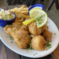 Fish and Chips · Tempura battered Icelandic cod, Mama's garlic Parmesan fries, tartar sauce and cole slaw.