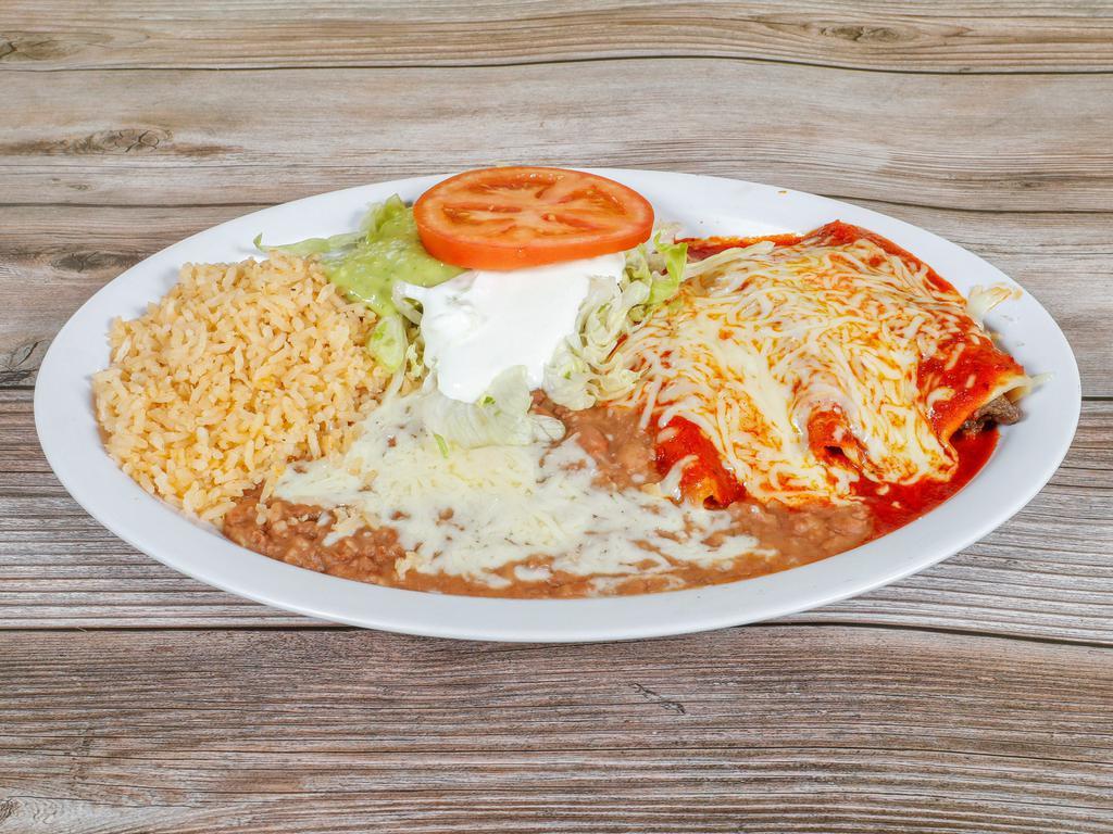 Enchilada Plate · 3 enchiladas with choice of meat, rice, beans, cheese, sour cream, guacamole, lettuce and tomatoes.