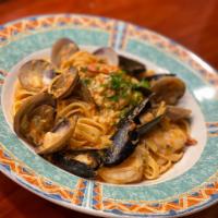Fettuccine Fruiti di Mare · Clams, mussels, shrimps, and scallops in a light cream and tomato sauce.