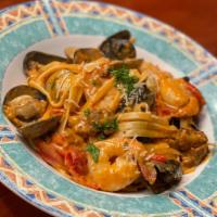 Fettuccine Jambalaya · clams, mussels, Shrimp, Italian sausage, scallops, bell peppers, creamy garlic sauce, a touc...