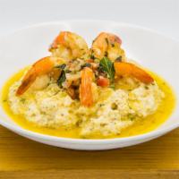 Shrimp and Grits · jumbo shrimp sautéed in white wine, shallots, garlic, tomato and basil served with George Wa...