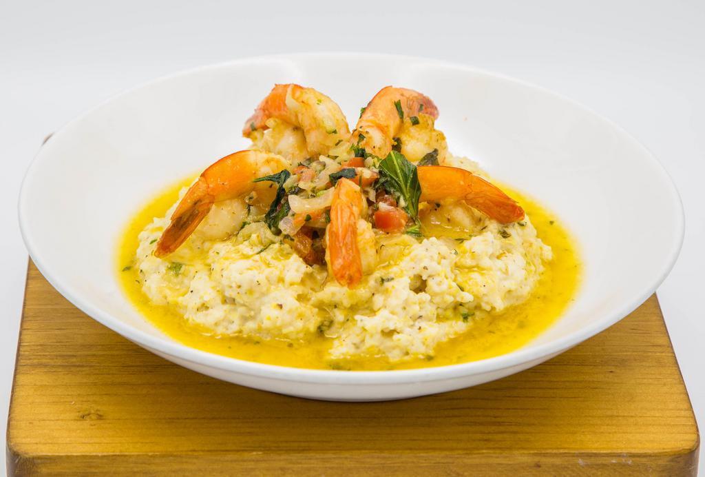 Shrimp and Grits · jumbo shrimp sautéed in white wine, shallots, garlic, tomato and basil served with George Washington’s  Gristmill Grits