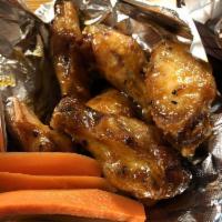 Spicy Buffalo Wings · Our House-Smoked Wings, tossed in our House-Made Spicy Buffalo Sauce. Medium Spicy Heat. Ser...