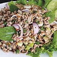 22. Larb · Minced pork, shallots, green onions, roasted rice powder and mint leaves tossed in spicy lim...