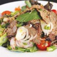 24. Yum Near · Beef char-grilled, fresh spring mix, tomatoes, cucumbers, carrot, onions, shallots, mint lea...