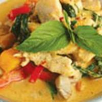 33. Pumpkin Curry Chicken · Home-made red curry paste with Thai pumpkin, coconut milk, bell peppers, and Thai basil. Spi...