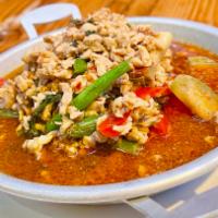 34. Jungle Curry Chicken · Home-made red curry paste with minced chicken, holy basil, Thai eggplants, bell peppers and ...