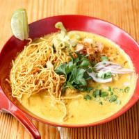 35. Khao Soi Chicken · This typical Northern Thai influenced dish is served with egg noodles in a curry base with a...