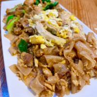 61. Pad See Eew with Chicken · Stir fried chicken with wide rice noddles, egg, and Chinese broccoli. Gluten free. Contains ...