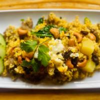 66. Pineapple Fried rice with Beef · Fried rice with eggs, pineapples, raisins, cashew nuts, tomatoes, chinese broccoli, curry po...