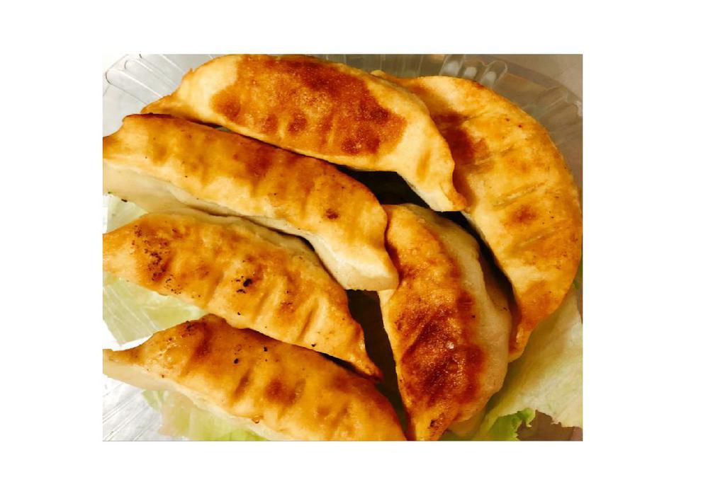 2. Pot Stickers · 6 pieces Pot Stickers made in with Chicken, Pork and Vegetables, damping lightly Pan-fried. Dressing on the side.