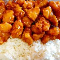 41. Orange Chicken over Rice · Elegant Asian flavored Orange Chicken with a bed of steamed White Rice.