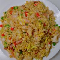 21. Combination Fried Rice · Stir-fried Rice with egg, green peas, carrots with shrimp, BBQ pork and Chicken.  