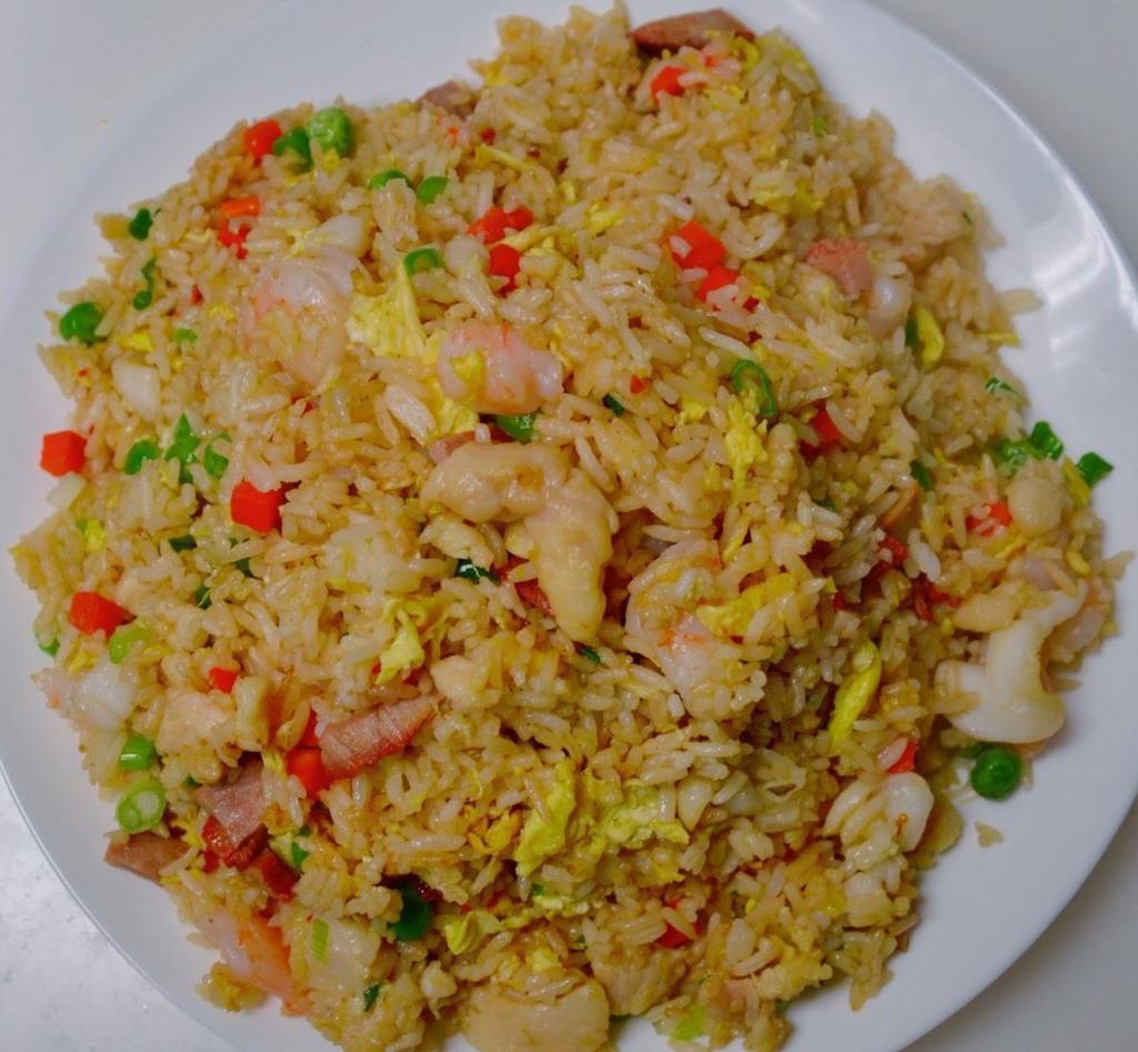 21. Combination Fried Rice · Stir-fried Rice with egg, green peas, carrots with shrimp, BBQ pork and Chicken.  
