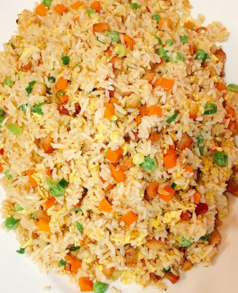 25. BBQ Pork Fried Rice · Stir-fried Rice with egg, green peas, carrots with BBQ pork.
