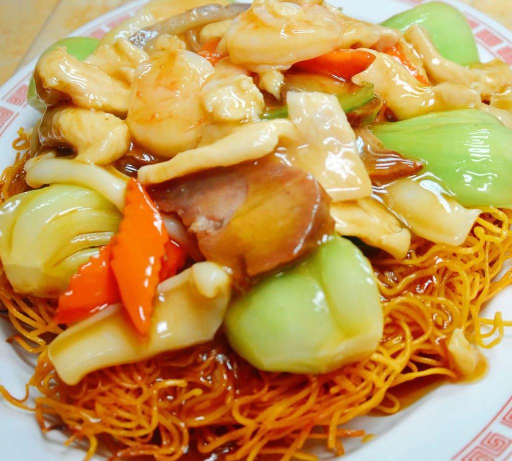 49. Hong Kong Style Crispy Chow Mein · Lightly pan fried Hong Kong style egg noodles topped with mixed fish shrimp Calamari and seasonal vegetables in seafood Sauce.