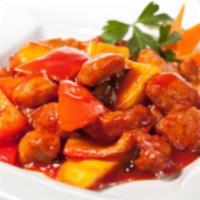 75. Sweet and Sour Pork · Deep fried breaded Pork stir-fried with pineapples, bell pepper, onions in sweet & sour sauc...