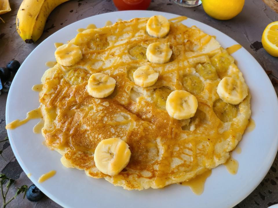 Banana Pancake · Banana pancake with Chantilly sauce.