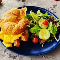 Breakfast Croissant Sandwich · Bacon, onions, cheddar cheese, egg omelet, house potato.