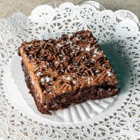 Brownie · Rich chocolate fudge brownie covered in fudge icing with or without nuts.