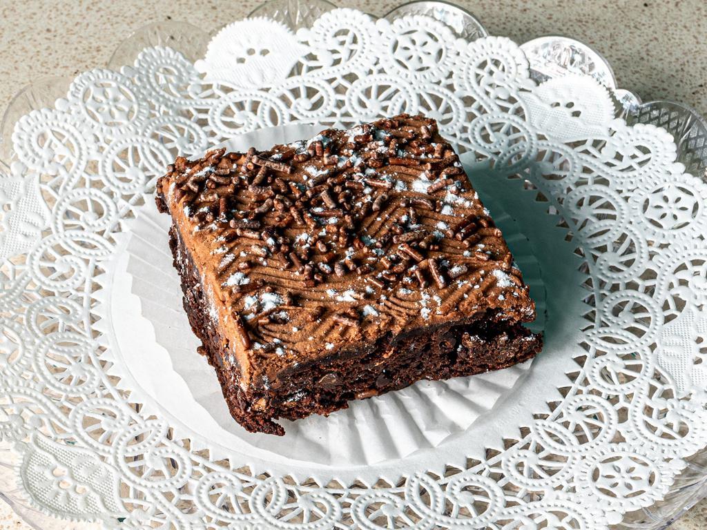 Brownie · Rich chocolate fudge brownie covered in fudge icing with or without nuts.